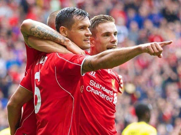 LIVERPOOL, ENGLAND - Sunday, August 10, 2014: Liverpool's Dejan Lovren celebrates scoring the second goal against Borussia Dortmund during a preseason friendly match at Anfield. (Pic by David Rawcliffe/Propaganda)