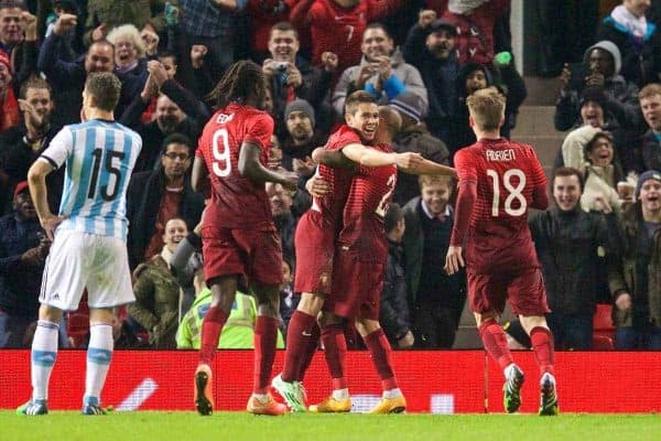 MANCHESTER, ENGLAND - Tuesday, November 18, 2014: Portugal's Raphael Guerreiro celebrates scoring the winning goal in injury time against Argentina during the International Friendly match at Old Trafford. (Pic by David Rawcliffe/Propaganda)