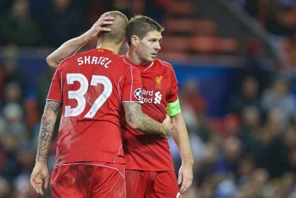 LIVERPOOL, ENGLAND - Tuesday, December 9, 2014: Liverpool's captain Steven Gerrard consoles a dejected Martin Skrtel as they draw 1-1 with FC Basel and are knocked out of the UEFA Champions League and are forced to suffer the ignominy of the Europa League at Anfield. (Pic by David Rawcliffe/Propaganda)