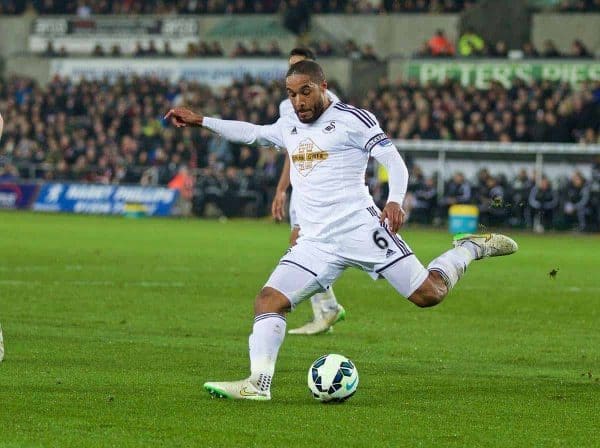 SWANSEA, ENGLAND - Monday, March 16, 2015: Swansea City's captain Ashley Williams in action against Liverpool during the Premier League match at the Liberty Stadium. (Pic by David Rawcliffe/Propaganda)