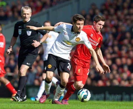 LIVERPOOL, ENGLAND - Sunday, March 22, 2015: Liverpool's Joe Allen barely touches Manchester United's Ander Herrera, who goes down heavily, the Liverpool player is then shown a yellow card by referee Martin Atkinson during the Premier League match at Anfield. (Pic by David Rawcliffe/Propaganda)