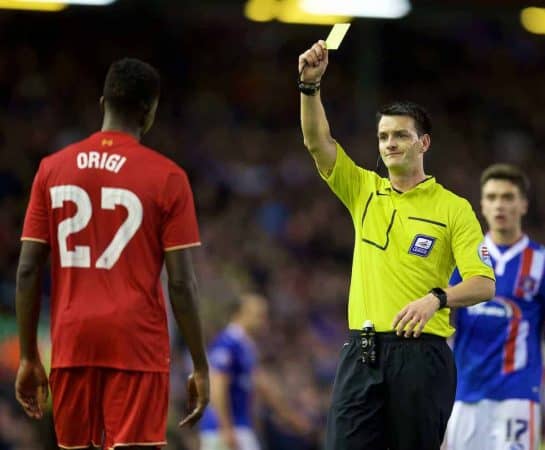 LIVERPOOL, ENGLAND - Wednesday, September 23, 2015: Liverpool's Divock Origi is shown a yellow card by referee Andrew Madley against Carlisle United during the Football League Cup 3rd Round match at Anfield. (Pic by David Rawcliffe/Propaganda)