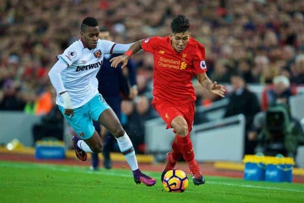 LIVERPOOL, ENGLAND - Sunday, December 11, 2016: Liverpool's Roberto Firmino in action against West Ham United's Enner Valencia during the FA Premier League match at Anfield. (Pic by David Rawcliffe/Propaganda)