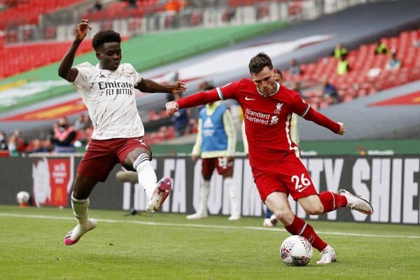 LONDON, ENGLAND - Saturday, August 29, 2020: Liverpool’s Andy Robertson (R) crosses the ball under pressure from Arsenal’s Bukayo Sako during the FA Community Shield match between FA Premier League Champions Liverpool FC and FA Cup Winners Arsenal FC. The game was played behind closed doors. (Credit: Eddie Keogh/The FA)