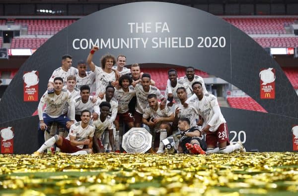 LONDON, ENGLAND - Saturday, August 29, 2020: Arsenal players celebrate with the trophy after winning a penalty shoot-out against Liverpool following a 1-1 draw during the FA Community Shield match between FA Premier League Champions Liverpool FC and FA Cup Winners Arsenal FC. The game was played behind closed doors. Arsenal won 5-4 on penalties. (Credit: Eddie Keogh/The FA)