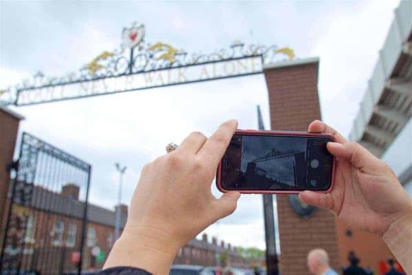 LIVERPOOL, ENGLAND - Sunday, May 21, 2017: A supporter take a photo of the Liverpool club crest above the Shankly gates outside Anfield ahead of the FA Premier League match between Liverpool and Middlesbrough. (Pic by David Rawcliffe/Propaganda)