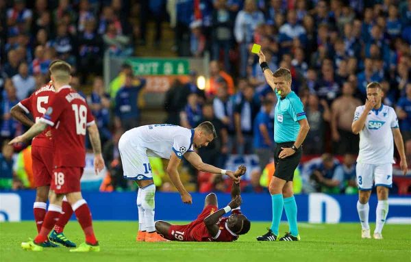 LIVERPOOL, ENGLAND - Wednesday, August 23, 2017: TSG 1899 Hoffenheim's Sandro Wagner is shown a yellow card by referee Daniele Orsato for a foul on Liverpool's Sadio Mane during the UEFA Champions League Play-Off 2nd Leg match between Liverpool and TSG 1899 Hoffenheim at Anfield. (Pic by David Rawcliffe/Propaganda)