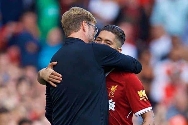 LIVERPOOL, ENGLAND - Sunday, August 27, 2017: Liverpool's manager J¸rgen Klopp embraces Roberto Firmino after he substitutes him during the FA Premier League match between Liverpool and Arsenal at Anfield. (Pic by David Rawcliffe/Propaganda)