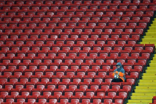 LIVERPOOL, ENGLAND - Friday, September 22, 2017: A steward acts as a ball boy sitting in empty red seats during the Under-23 FA Premier League 2 Division 1 match between Liverpool and Tottenham Hotspur at Anfield. (Pic by David Rawcliffe/Propaganda)