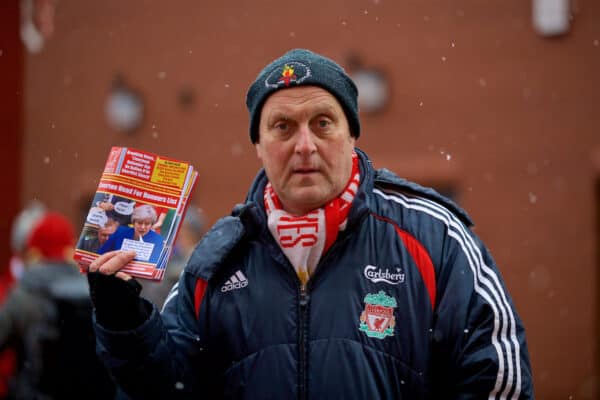 LIVERPOOL, ENGLAND - Sunday, December 10, 2017: A man sells copies of Red All Over The Land fanzine before the FA Premier League match between Liverpool and Everton, the 229th Merseyside Derby, at Anfield. (Pic by David Rawcliffe/Propaganda)