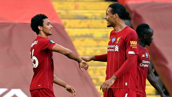 Liverpool’s Trent Alexander-Arnold celebrates with Virgil Van Dijk (Paul Ellis/NMC Pool/PA)