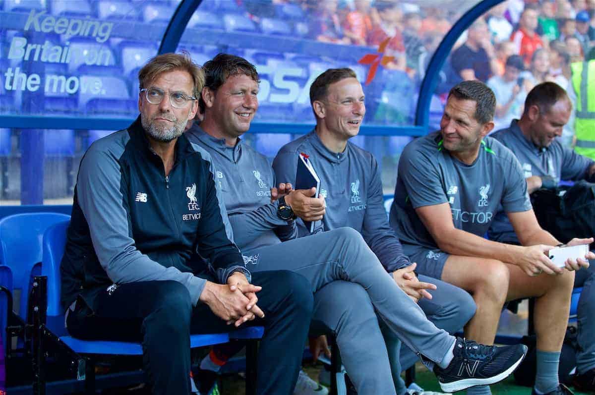 BIRKENHEAD, ENGLAND - Tuesday, July 10, 2018: Liverpool's manager J¸rgen Klopp sits on the bench with his staff first team coach Peter Krawietz, first-team development coach Pepijn Lijnders, goalkeeping coach John Achterberg before a preseason friendly match between Tranmere Rovers FC and Liverpool FC at Prenton Park. (Pic by Paul Greenwood/Propaganda)