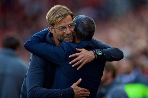 LIVERPOOL, ENGLAND - Saturday, August 25, 2018: Liverpool's manager Jürgen Klopp embraces Brighton & Hove Albion's manager Chris Hughton before the FA Premier League match between Liverpool FC and Brighton & Hove Albion FC at Anfield. (Pic by David Rawcliffe/Propaganda)