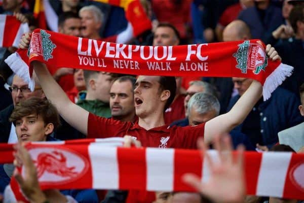 LIVERPOOL, ENGLAND - Saturday, August 25, 2018: A Liverpool supporter holds his scarf up as he sings "You'll Never Walk Alone" during the FA Premier League match between Liverpool FC and Brighton & Hove Albion FC at Anfield. (Pic by David Rawcliffe/Propaganda)