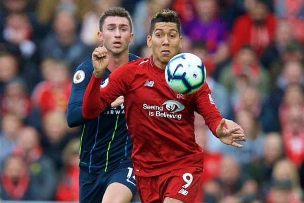 LIVERPOOL, ENGLAND - Sunday, October 7, 2018: Liverpool's Roberto Firmino (R) and Manchester City's Aymeric Laporte during the FA Premier League match between Liverpool FC and Manchester City FC at Anfield. (Pic by David Rawcliffe/Propaganda)