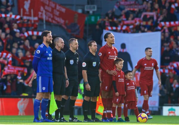 LIVERPOOL, ENGLAND - Saturday, October 27, 2018: Liverpool's captain Virgil van Dijk (R) and Cardiff City's captain Sean Morrison line-up with referee Stuart Atwell before the FA Premier League match between Liverpool FC and Cardiff City FC at Anfield. (Pic by David Rawcliffe/Propaganda)