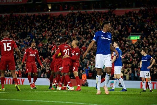 LIVERPOOL, ENGLAND - Sunday, December 2, 2018: Liverpool's Divock Origi (#27) celebrates with team-mates Georginio Wijnaldum (L), Sadio Mane (C) and Fabio Henrique Tavares 'Fabinho' (R) after his winning goal deep into injury time during the FA Premier League match between Liverpool FC and Everton FC at Anfield, the 232nd Merseyside Derby. Liverpool won 1-0. (Pic by Paul Greenwood/Propaganda)