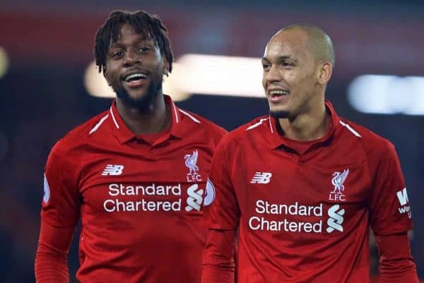 LIVERPOOL, ENGLAND - Sunday, December 2, 2018: Liverpool's match winning goal-scorer Divock Origi (L) celebrates with Fabio Henrique Tavares 'Fabinho' and Georginio Wijnaldum after a dramatic late injury time goal during the FA Premier League match between Liverpool FC and Everton FC at Anfield, the 232nd Merseyside Derby. Liverpool won 1-0. (Pic by Paul Greenwood/Propaganda)