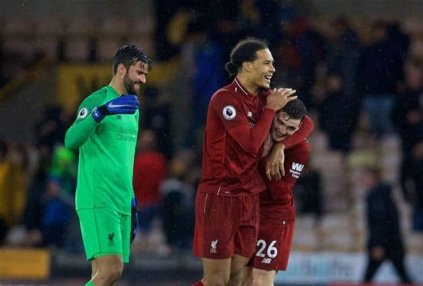 WOLVERHAMPTON, ENGLAND - Friday, December 21, 2018: Liverpool's goal-scorer Virgil van Dijk celebrates with team-mates Andy Robertson (R) and goalkeeper Alisson Becker (L) after beating Wolverhampton Wanderers 2-0 during the FA Premier League match between Wolverhampton Wanderers FC and Liverpool FC at Molineux Stadium. (Pic by David Rawcliffe/Propaganda)