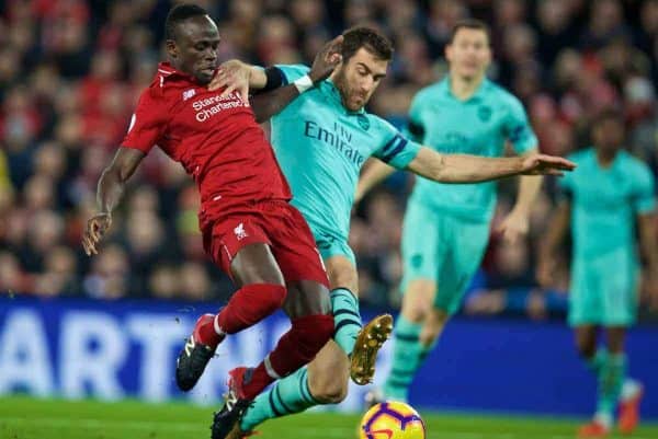 LIVERPOOL, ENGLAND - Saturday, December 29, 2018: Liverpool's Sadio Mane (L) and Arsenal's Sokratis Papastathopoulos (R) during the FA Premier League match between Liverpool FC and Arsenal FC at Anfield. (Pic by David Rawcliffe/Propaganda)