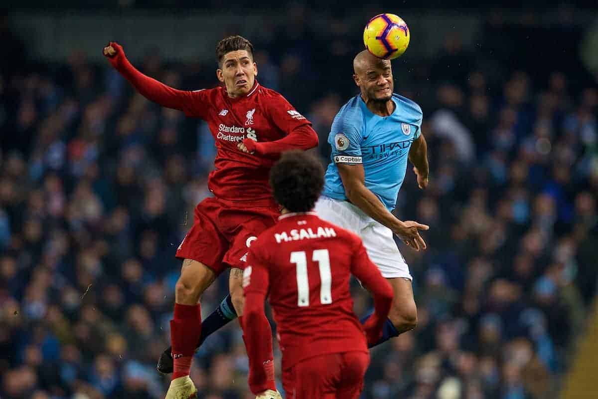 MANCHESTER, ENGLAND - Thursday, January 3, 2019: Liverpool's Roberto Firmino (L) and Manchester City's captain Vincent Kompany during the FA Premier League match between Manchester City FC and Liverpool FC at the Etihad Stadium. (Pic by David Rawcliffe/Propaganda)