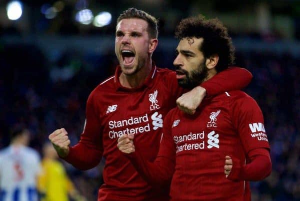 BRIGHTON AND HOVE, ENGLAND - Saturday, January 12, 2019: Liverpool's Mohamed Salah celebrates scoring the winning goal from a penalty kick with team-mate captain Jordan Henderson (L) during the FA Premier League match between Brighton & Hove Albion FC and Liverpool FC at the American Express Community Stadium. Liverpool won 1-0. (Pic by David Rawcliffe/Propaganda)