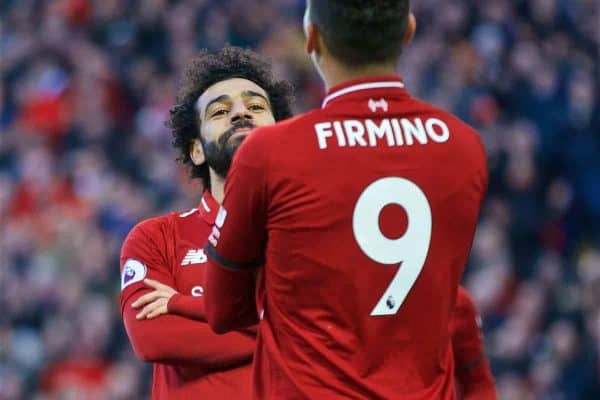 LIVERPOOL, ENGLAND - Saturday, February 9, 2019: Liverpool's Mohamed Salah celebrates scoring the third goal with team-mate Roberto Firmino during the FA Premier League match between Liverpool FC and AFC Bournemouth at Anfield. (Pic by David Rawcliffe/Propaganda)