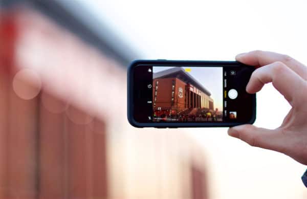 LIVERPOOL, ENGLAND - Wednesday, February 27, 2019: A Liverpool supporter takes a photo of the new Main Stand with his iPhone ahead of the FA Premier League match between Liverpool FC and Watford FC at Anfield. (Pic by Paul Greenwood/Propaganda)