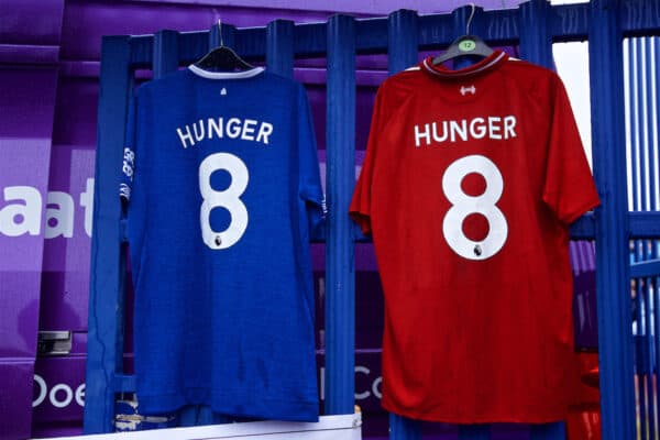 LIVERPOOL, ENGLAND - Sunday, March 3, 2019: An Everton and Liverpool shirt hanging side--by-side with "8 Hunger" on them at a Food Bank during the FA Premier League match between Everton FC and Liverpool FC, the 233rd Merseyside Derby, at Goodison Park.  Supporters of both clubs give to food banks, set up to help feed people left with no money due to the Conservative government's evil austerity measures. (Pic by Laura Malkin/Propaganda)