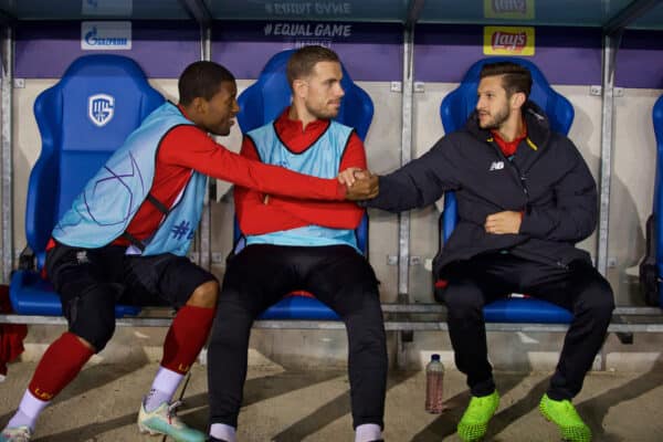 GENK, BELGIUM - Wednesday, October 23, 2019: Liverpool's substitutes (L-R) Georginio Wijnaldum, captain Jordan Henderson and Adam Lallana on the bench before the UEFA Champions League Group E match between KRC Genk and Liverpool FC at the KRC Genk Arena. (Pic by David Rawcliffe/Propaganda)