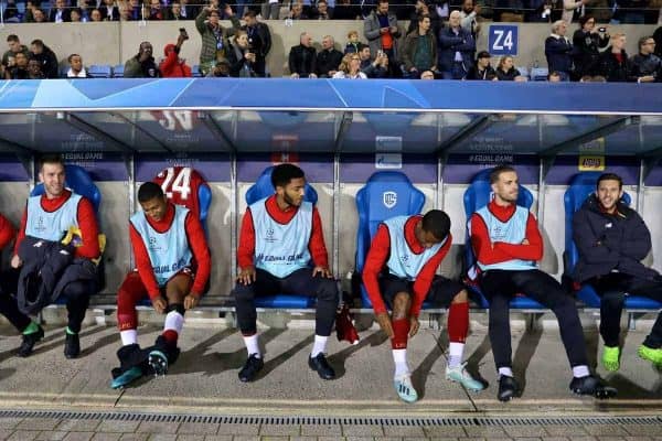 GENK, BELGIUM - Wednesday, October 23, 2019: Liverpool's substitutes (L-R) Divock Origi, goalkeeper Adrián San Miguel del Castillo, Rhian Brewster, Joe Gomez, Georginio Wijnaldum, captain Jordan Henderson and Adam Lallana on the bench before the UEFA Champions League Group E match between KRC Genk and Liverpool FC at the KRC Genk Arena. (Pic by David Rawcliffe/Propaganda)