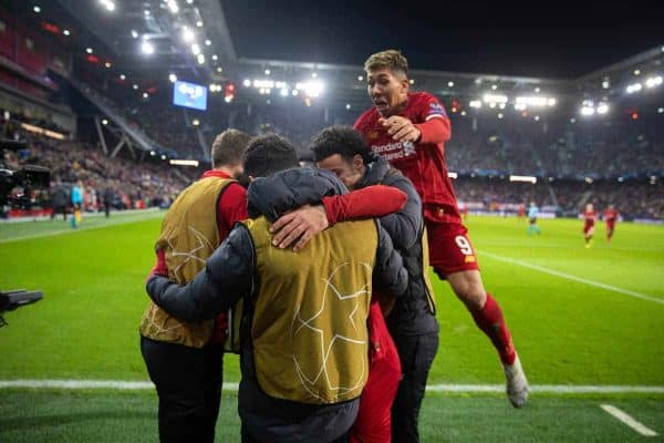 SALZBURG, AUSTRIA - Tuesday, December 10, 2019: Liverpool's Mohamed Salah (hidden) celebrates scoring the second goal with team-mates as Roberto Firmino jumps ontop during the final UEFA Champions League Group E match between FC Salzburg and Liverpool FC at the Red Bull Arena. (Pic by David Rawcliffe/Propaganda)