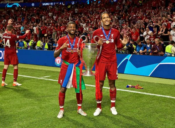 MADRID, SPAIN - SATURDAY, JUNE 1, 2019: Liverpool's Georginio Wijnaldum (L) and Virgil van Dijk (R) with the trophy after the UEFA Champions League Final match between Tottenham Hotspur FC and Liverpool FC at the Estadio Metropolitano. Liverpool won 2-0 to win their sixth European Cup. (Pic by David Rawcliffe/Propaganda)