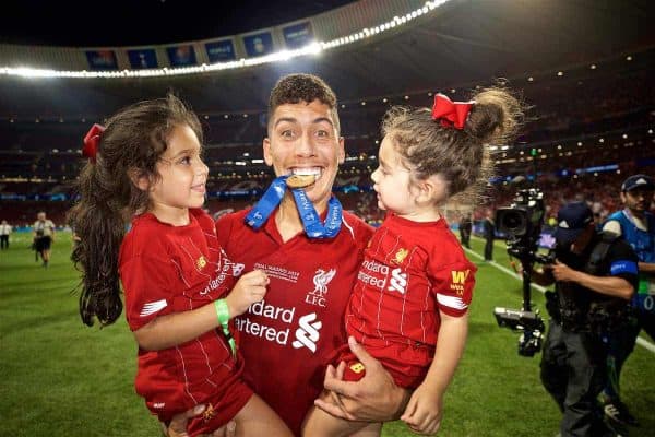 MADRID, SPAIN - SATURDAY, JUNE 1, 2019: Liverpool's Roberto Firmino bites his medal with his children after the UEFA Champions League Final match between Tottenham Hotspur FC and Liverpool FC at the Estadio Metropolitano. Liverpool won 2-0 to win their sixth European Cup. (Pic by David Rawcliffe/Propaganda)