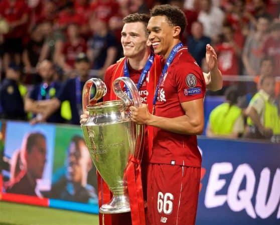 MADRID, SPAIN - SATURDAY, JUNE 1, 2019: Liverpool's Andy Robertson (L) and Trent Alexander-Arnold with the trophy after the UEFA Champions League Final match between Tottenham Hotspur FC and Liverpool FC at the Estadio Metropolitano. Liverpool won 2-0 to win their sixth European Cup. (Pic by David Rawcliffe/Propaganda)