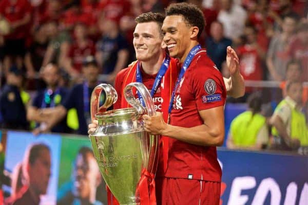 MADRID, SPAIN - SATURDAY, JUNE 1, 2019: Liverpool's Andy Robertson (L) and Trent Alexander-Arnold with the trophy after the UEFA Champions League Final match between Tottenham Hotspur FC and Liverpool FC at the Estadio Metropolitano. Liverpool won 2-0 to win their sixth European Cup. (Pic by David Rawcliffe/Propaganda)
