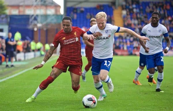 BIRKENHEAD, ENGLAND - Thursday, July 11, 2019: Liverpool's Nathaniel Clyne (L) and Tranmere Rovers' David Perkins during a pre-season friendly match between Tranmere Rovers FC and Liverpool FC at Prenton Park. (Pic by David Rawcliffe/Propaganda)