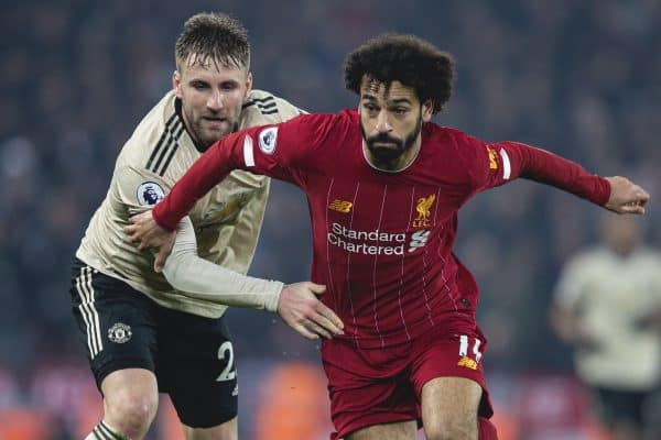 LIVERPOOL, ENGLAND - Sunday, January 19, 2020: Liverpool's Mohamed Salah (R) and Manchester United's Luke Shaw during the FA Premier League match between Liverpool FC and Manchester United FC at Anfield. (Pic by David Rawcliffe/Propaganda)