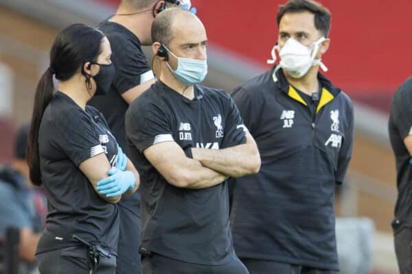 LIVERPOOL, ENGLAND - Wednesday, June 24, 2020: Liverpool’s medical staff wear face masks during the pre-match warm-up before the FA Premier League match between Liverpool FC and Crystal Palace FC at Anfield. The game was played behind closed doors due to the UK government’s social distancing laws during the Coronavirus COVID-19 Pandemic. (Pic by David Rawcliffe/Propaganda)