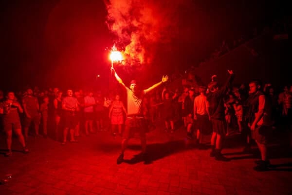LIVERPOOL, ENGLAND - Thursday, June 25, 2020: Liverpool supporters celebrate at Anfield after their side were crowned Premier League Champions following Manchester City's defeat by Chelsea. The supporters have waited 30 years for this their 19th Championship title. (Pic by David Rawcliffe/Propaganda)
