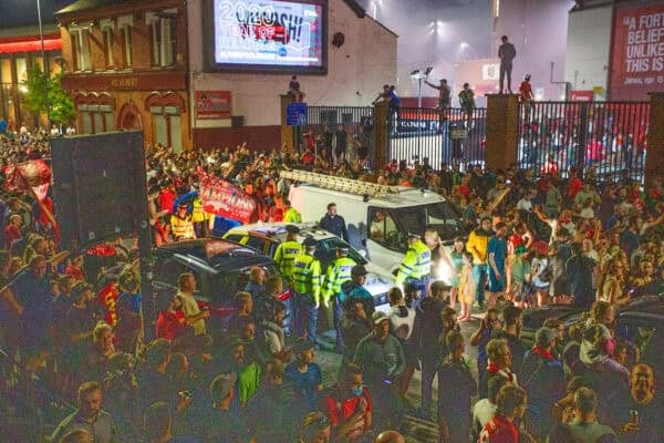 LIVERPOOL, ENGLAND - Thursday, June 25, 2020: Merseyside Police escort one of their vehicles out of the crowd as Liverpool supporters celebrate at Anfield after their side were crowned Premier League Champions following Manchester City's defeat by Chelsea. The supporters have waited 30 years for this their 19th Championship title. (Pic by David Rawcliffe/Propaganda)