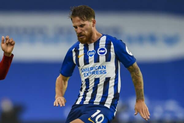 BRIGHTON & HOVE, ENGLAND - Wednesday, July 8, 2020: Liverpool's Trent Alexander-Arnold crosses the ball under pressure from Brighton & Hove Albion's Alexis Mac Allister during the FA Premier League match between Brighton & Hove Albion FC and Liverpool FC at the AMEX Stadium. The game was played behind closed doors due to the UK government’s social distancing laws during the Coronavirus COVID-19 Pandemic. (Pic by Propaganda)