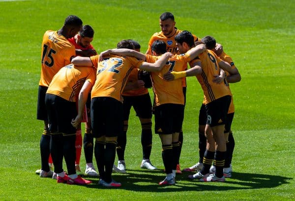 WOLVERHAMPTON, ENGLAND - Sunday, July 12, 2020: Wolverhampton Wanderers form a pre-match huddle before the FA Premier League match between Wolverhampton Wanderers FC and Everton FC at Molineux Stadium. The game was played behind closed doors due to the UK government’s social distancing laws during the Coronavirus COVID-19 Pandemic. (Pic by David Rawcliffe/Propaganda)