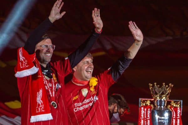 LIVERPOOL, ENGLAND - Wednesday, July 22, 2020: Liverpool’s manager Jürgen Klopp (L) and assistant manager Peter Krawietz celebrate on the podium during the trophy presentation as the Reds are crowned Champions after the FA Premier League match between Liverpool FC and Chelsea FC at Anfield. The game was played behind closed doors due to the UK government’s social distancing laws during the Coronavirus COVID-19 Pandemic. (Pic by David Rawcliffe/Propaganda)