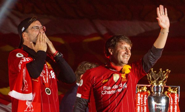 LIVERPOOL, ENGLAND - Wednesday, July 22, 2020: Liverpool’s manager Jürgen Klopp (L) and assistant manager Peter Krawietz celebrate on the podium during the trophy presentation as the Reds are crowned Champions after the FA Premier League match between Liverpool FC and Chelsea FC at Anfield. The game was played behind closed doors due to the UK government’s social distancing laws during the Coronavirus COVID-19 Pandemic. (Pic by David Rawcliffe/Propaganda)