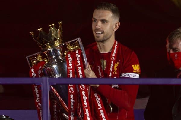 LIVERPOOL, ENGLAND - Wednesday, July 22, 2020: Liverpool’s captain Jordan Henderson collects the Premier League trophy during the trophy presentation as the Reds are crowned Champions after the FA Premier League match between Liverpool FC and Chelsea FC at Anfield. The game was played behind closed doors due to the UK government’s social distancing laws during the Coronavirus COVID-19 Pandemic. (Pic by David Rawcliffe/Propaganda)