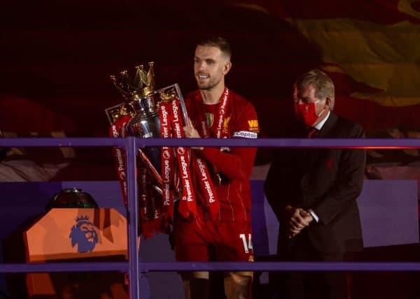 LIVERPOOL, ENGLAND - Wednesday, July 22, 2020: Liverpool’s captain Jordan Henderson collects the Premier League trophy during the trophy presentation as the Reds are crowned Champions after the FA Premier League match between Liverpool FC and Chelsea FC at Anfield. The game was played behind closed doors due to the UK government’s social distancing laws during the Coronavirus COVID-19 Pandemic. (Pic by David Rawcliffe/Propaganda)