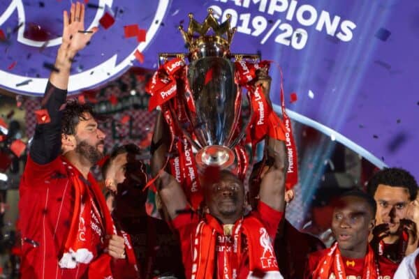 LIVERPOOL, ENGLAND - Wednesday, July 22, 2020: Liverpool’s Sadio Mané lifts the Premier League trophy during the presentation as the Reds are crowned Champions after the FA Premier League match between Liverpool FC and Chelsea FC at Anfield. The game was played behind closed doors due to the UK government’s social distancing laws during the Coronavirus COVID-19 Pandemic. (Pic by David Rawcliffe/Propaganda)