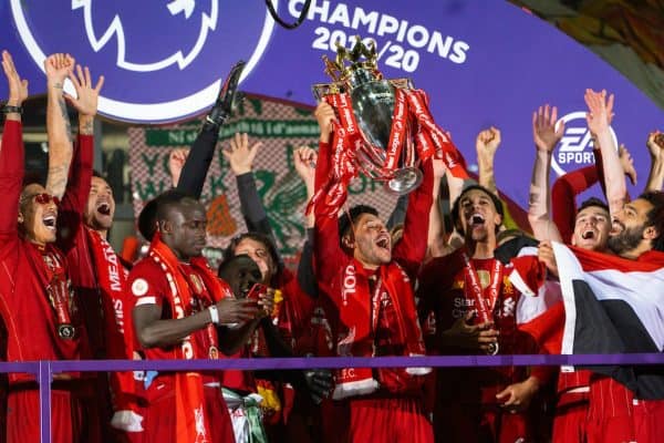 LIVERPOOL, ENGLAND - Wednesday, July 22, 2020: Liverpool’s Alex Oxlade-Chamberlain lifts the Premier League trophy during the presentation as the Reds are crowned Champions after the FA Premier League match between Liverpool FC and Chelsea FC at Anfield. The game was played behind closed doors due to the UK government’s social distancing laws during the Coronavirus COVID-19 Pandemic. (Pic by David Rawcliffe/Propaganda)