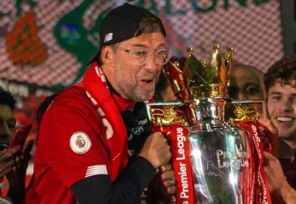 LIVERPOOL, ENGLAND - Wednesday, July 22, 2020: Liverpool’s manager Jürgen Klopp (L) and Adam Lallana (R) lift the Premier League trophy during the presentation as the Reds are crowned Champions after the FA Premier League match between Liverpool FC and Chelsea FC at Anfield. The game was played behind closed doors due to the UK government’s social distancing laws during the Coronavirus COVID-19 Pandemic. Also; Neco Williams, Mohamed Salah. (Pic by David Rawcliffe/Propaganda)